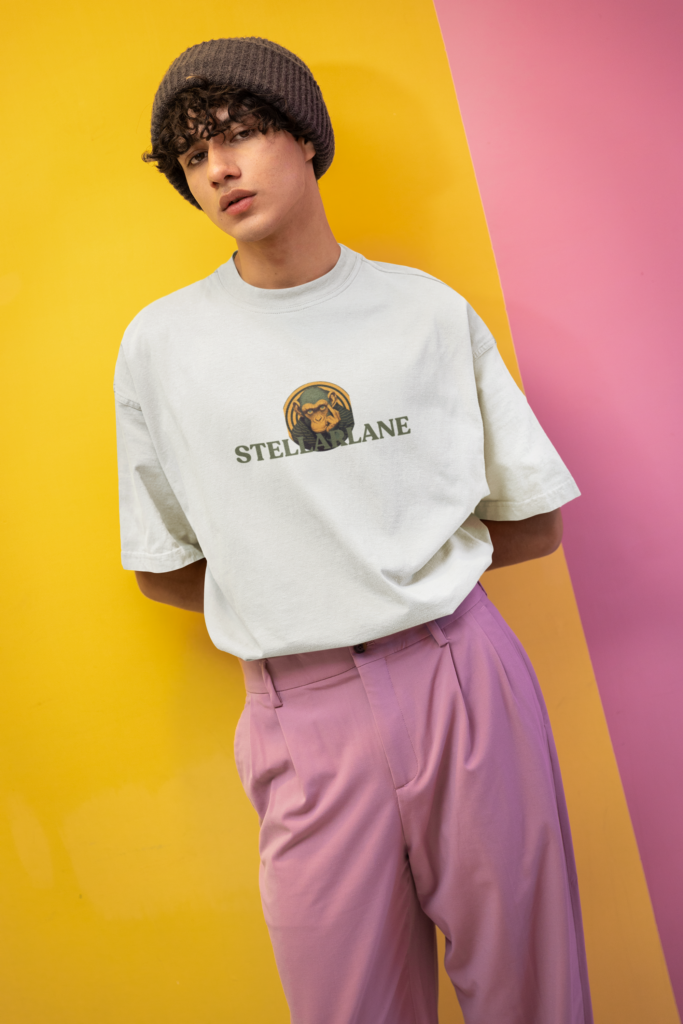 new pop wave style mockup of a man wearing an oversized tee in a colorful setting m38764
