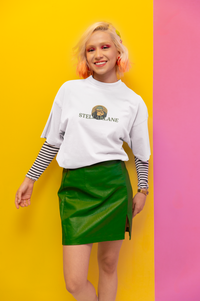 oversized tee mockup of a joyful woman posing in a new pop inspired aesthetic set m38756