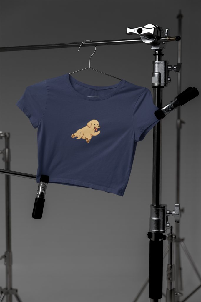 mockup of a bella canvas crop top hanging on photography tripods in a studio m37627 2 3